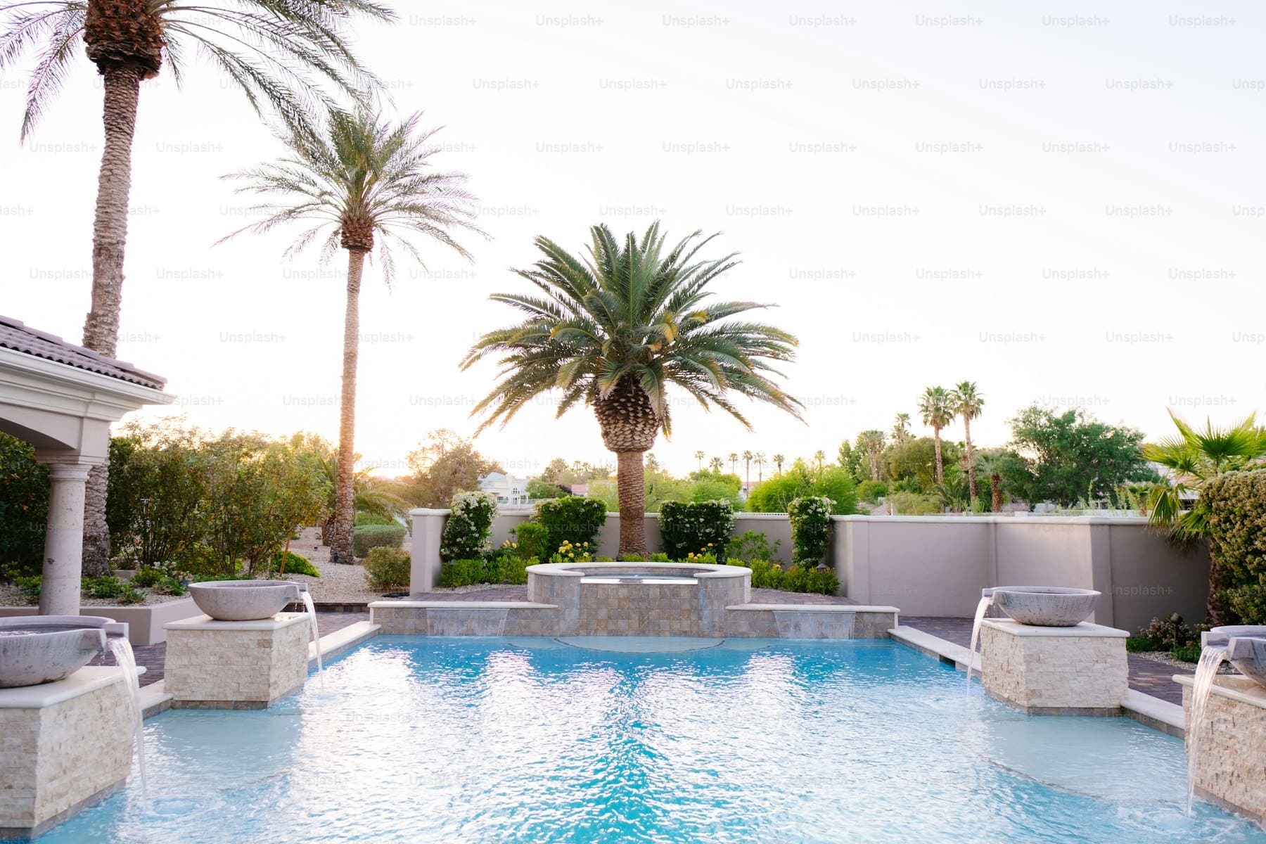 Pool deck with new pavers and coping around a backyard pool