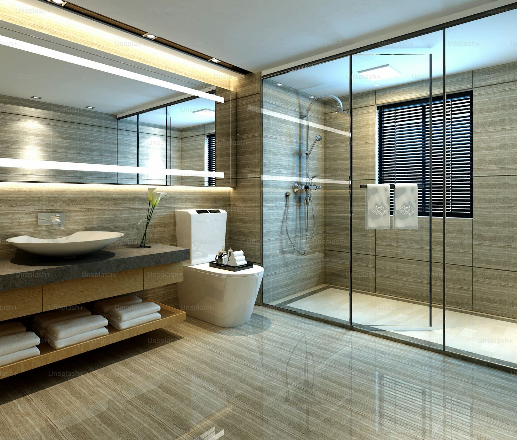 Renovated guest bathroom with tiled shower walls and a glass panel