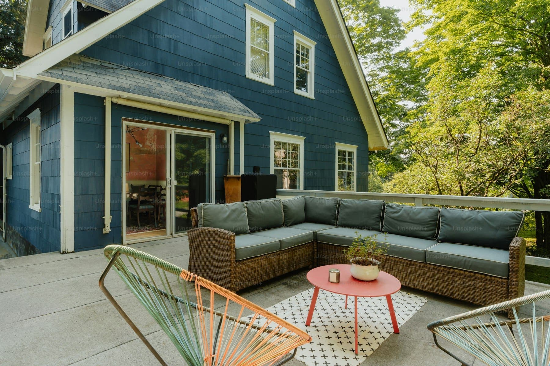 Covered outdoor patio with seating and a pergola