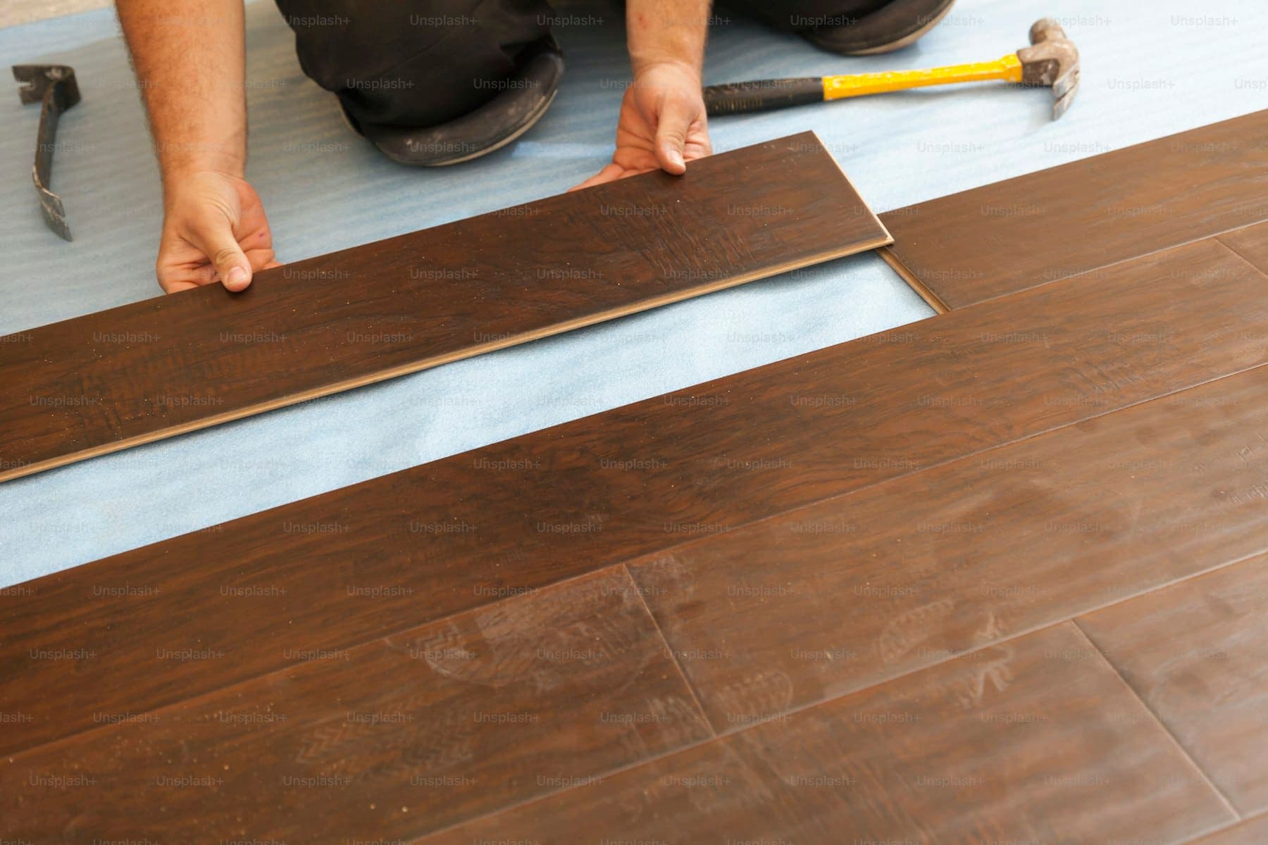 Wide-plank wood flooring running through a bright interior